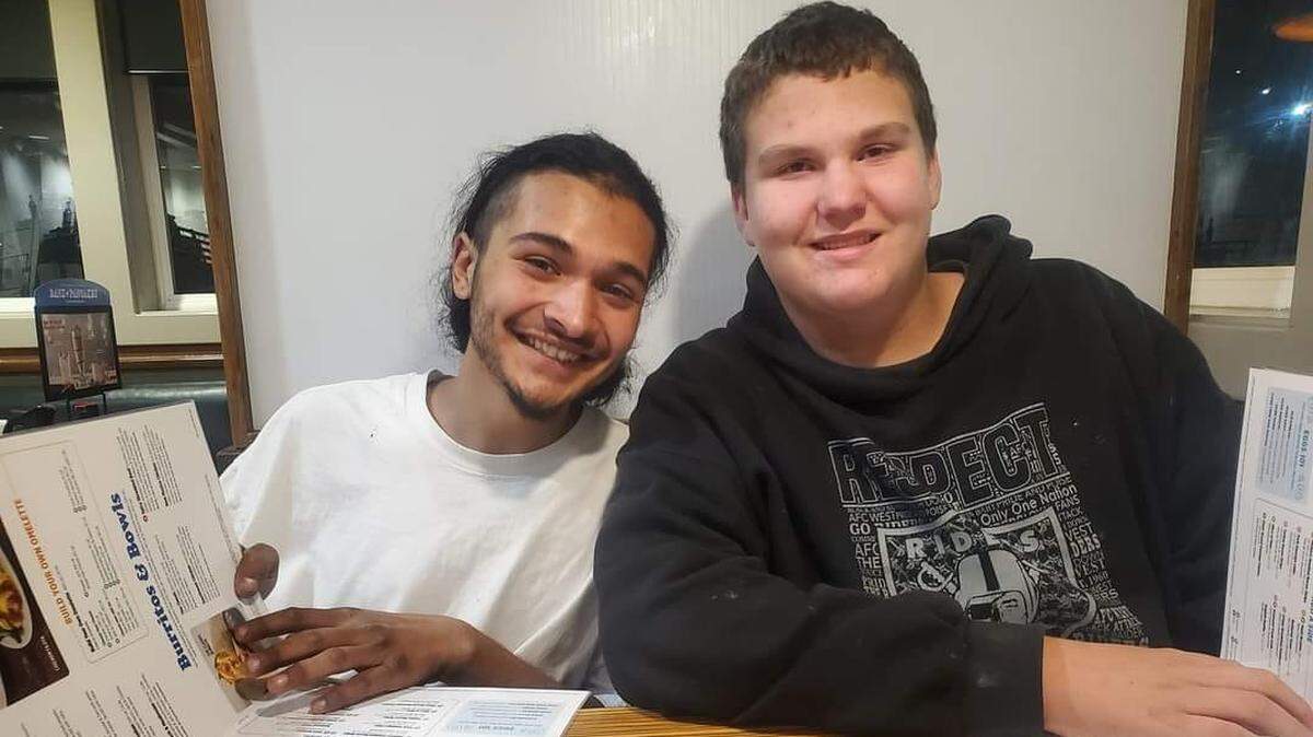 Christopher I. Hernandez, 20, sits with Israel Slavens, 13, at a Tri-Cities restaurant. Hernandez, who struggled with a fentanyl addiction, died this week in a car crash in Kennewick.