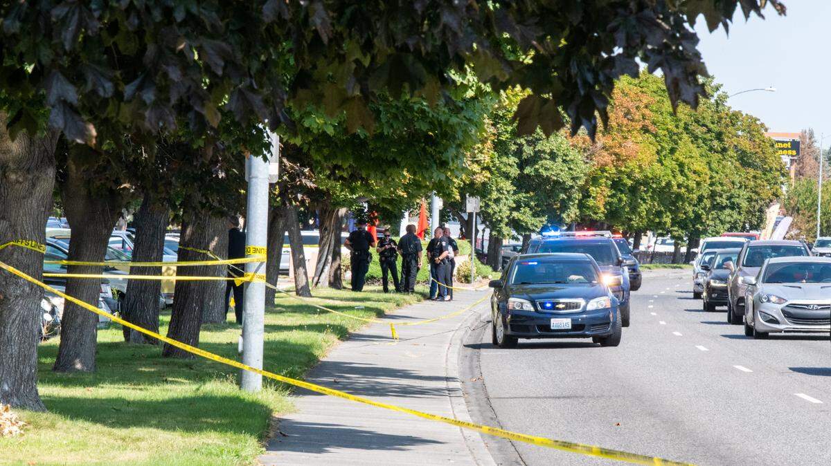 Police tape off the area of a shooting incident near the Village at Grandridge Apartments and the Circle K on Columbia Center Boulevard in Kennewick on Monday.