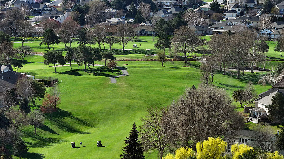 Golfers on the course at the Canyon Lakes Golf Course on South Olson Street in Kennewick.