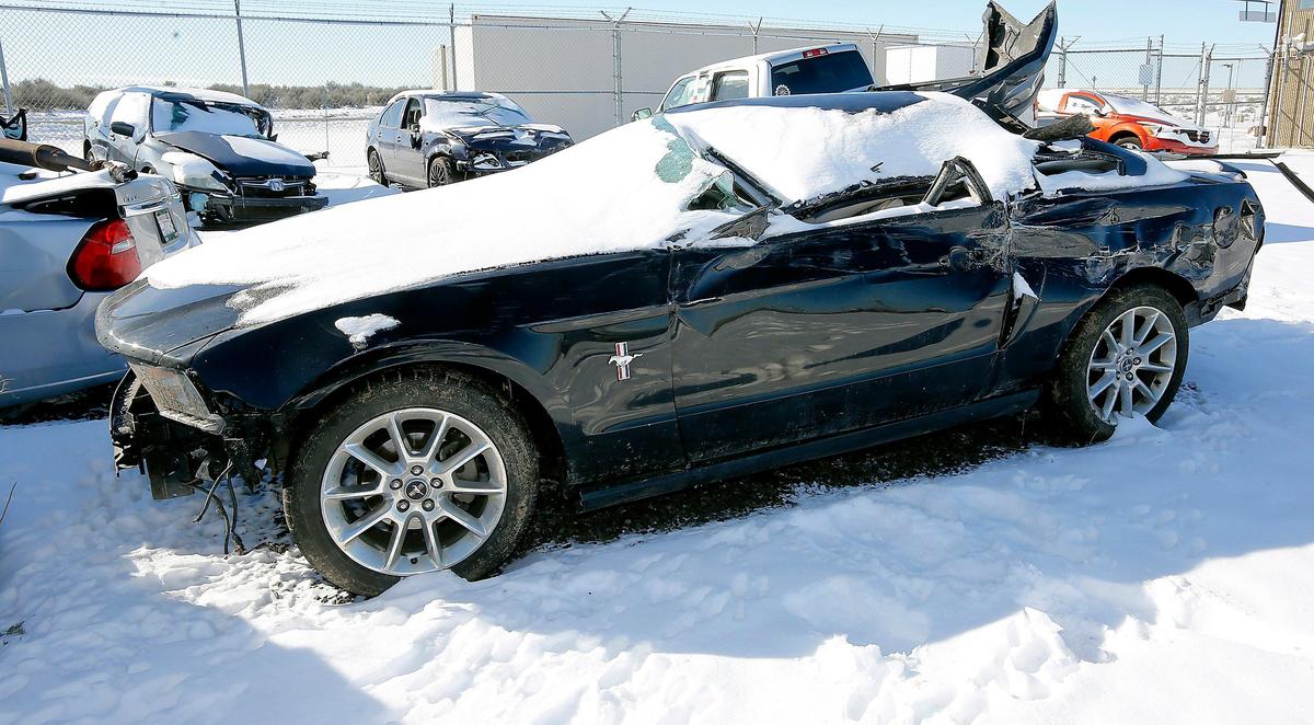 The 2010 Ford Mustang driven by Michelle Scheuerman, 48, sits in the Washington State Patrol impound lot in Kennewick. The Pasco woman is the second driver killed in Saturday’s multiple-car pileup on Interstate 182.