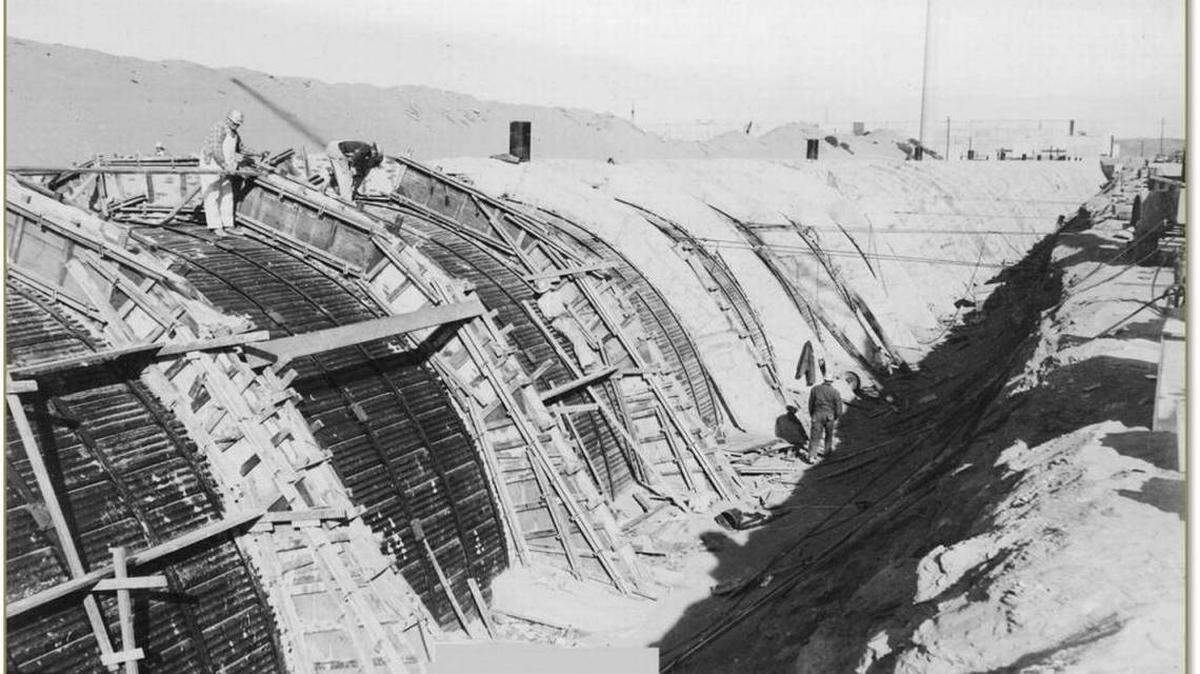 Steel beams running the length of a Hanford waste storage tunnel were bolted to concrete arches, shown as they were being built  over the outside of the tunnel. The possible collapse of the tunnel is both more likely than thought a year ago and the effects potentially more severe.