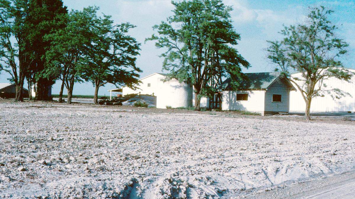 Ash from the May 18, 1980 eruption of Mount St. Helens covers the ground and road on June 2, 1980 at a farm in Connell, Wash., approximately 180 miles from the volcano.