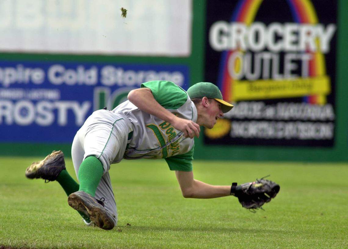 Richland’s Travis Buck knocks down a line drive in a 2000 game against North Central. Buck went on to play at Arizona State University and six years in the major leagues.