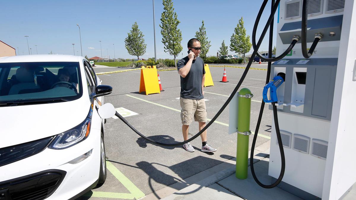 David Chen of Spokane tries using the new Southridge Electric Vehicle Charging Station on Monday for his new Chevrolet Bolt EV. He scheduled the stop after seeing it listed on a cellphone app, but the site isn't officially open until May 15.