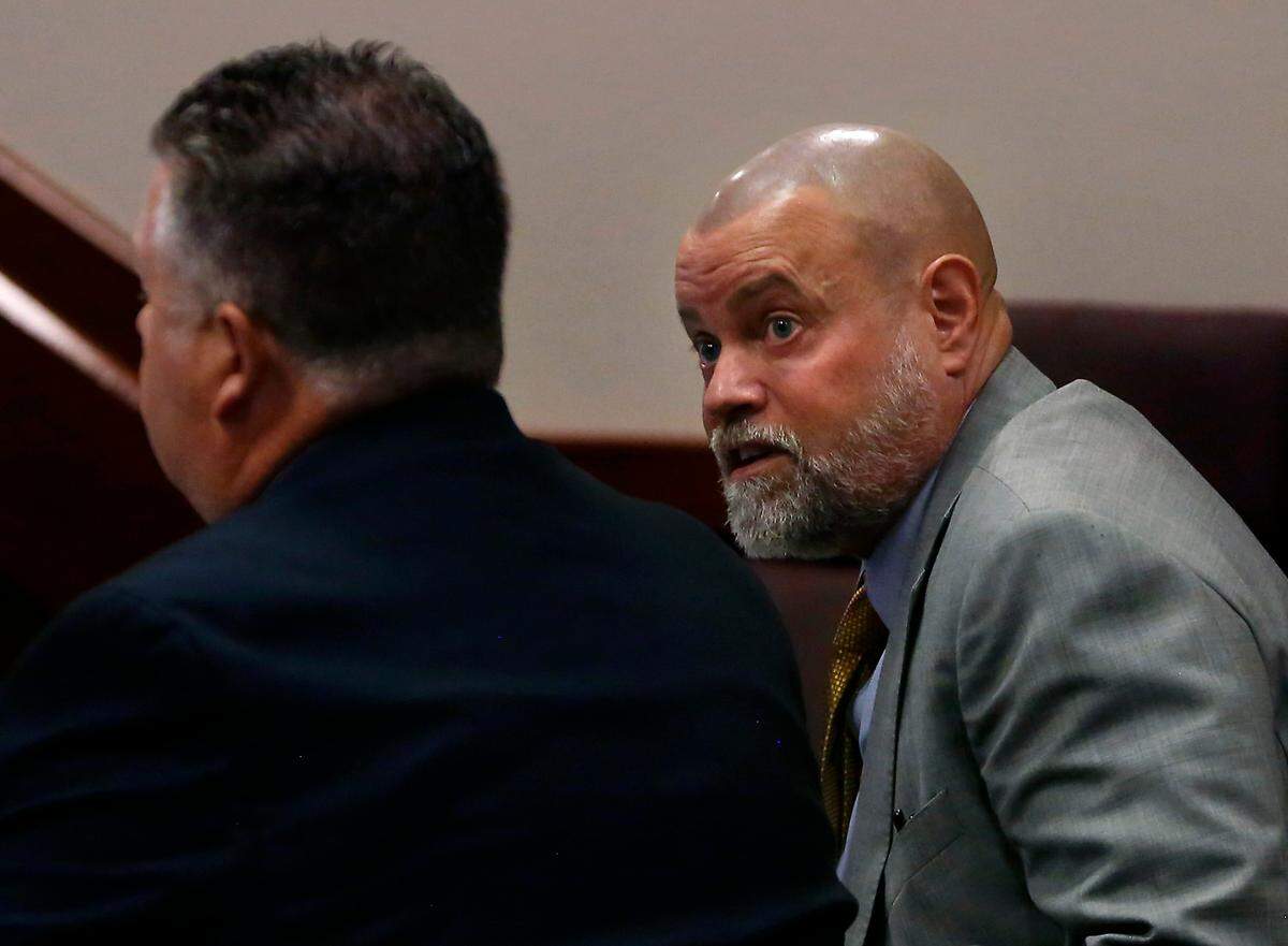 Judge Sam Swanberg, right, confers with his defense attorney Scott Johnson before the jury enters a Franklin County courtroom morning for the start of the judge’s domestic violence trial.