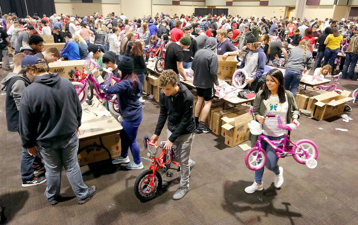 About 900 volunteers, including 600 high school students, fill the Three Rivers Convention Center in Kennewick on Friday for the 10th annual Bike Build for the Bikes for Tikes program. Organizers planned to assemble 2,000 bicycles in one day. The donated bikes will be given with helmets to children in need throughout the Mid-Columbia during the holidays. The program’s primary sponsors are the Plumbers and Steamfitters Local 598 union and related contractors.&nbsp;Watch a video at: tricityherald.com/videos.