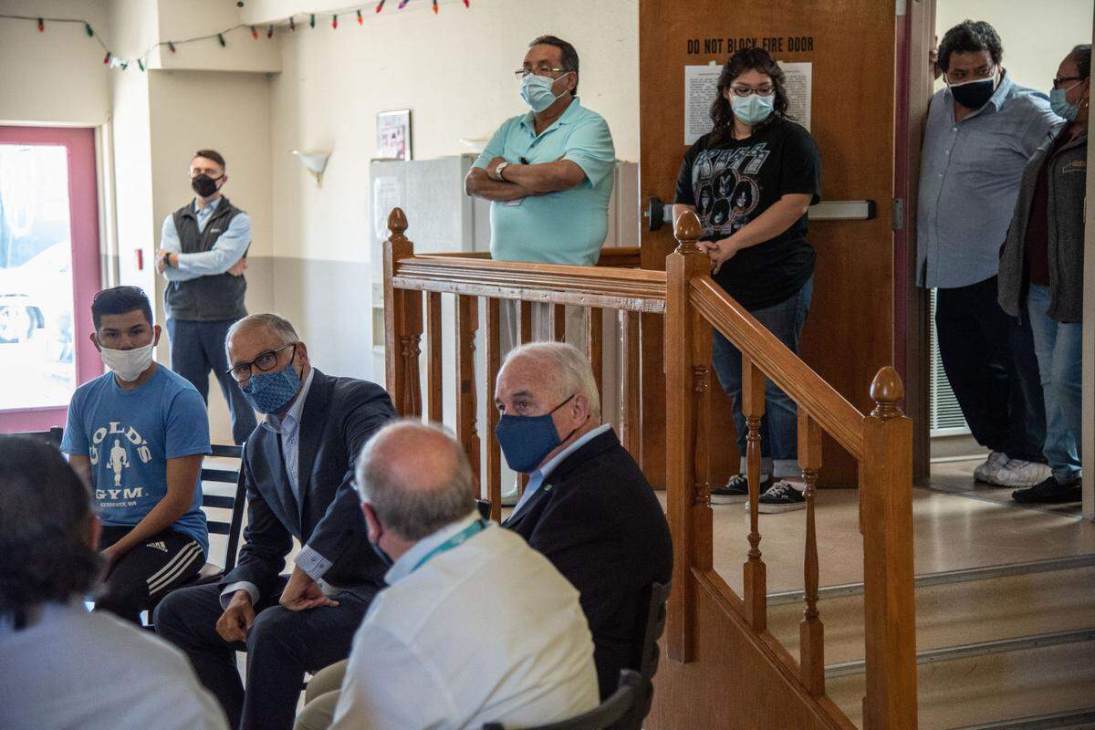 Gov. Jay Inslee visited Sea Mar La Posada East, a farmworker housing center in Pasco, on Wednesday. He spoke with workers, farmers and community leaders about how to get more people vaccinated and what to do about worker conditions and labor shortages.