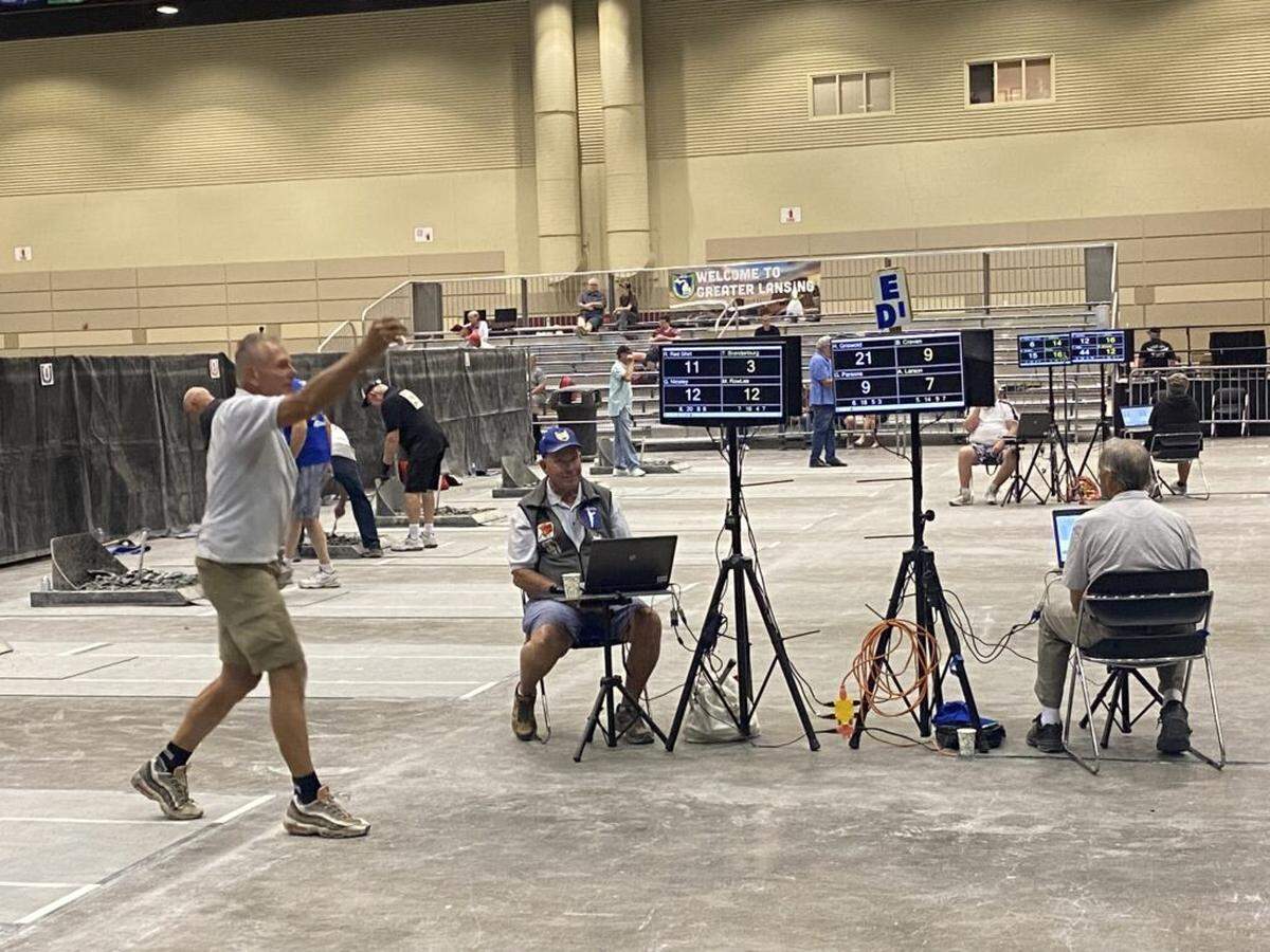 The 2024 National Horseshoe Pitchers Association World Tournament starts July 29 in Kennewick. Here a competitor pitches at the 2023 event in Lansing, Mich.