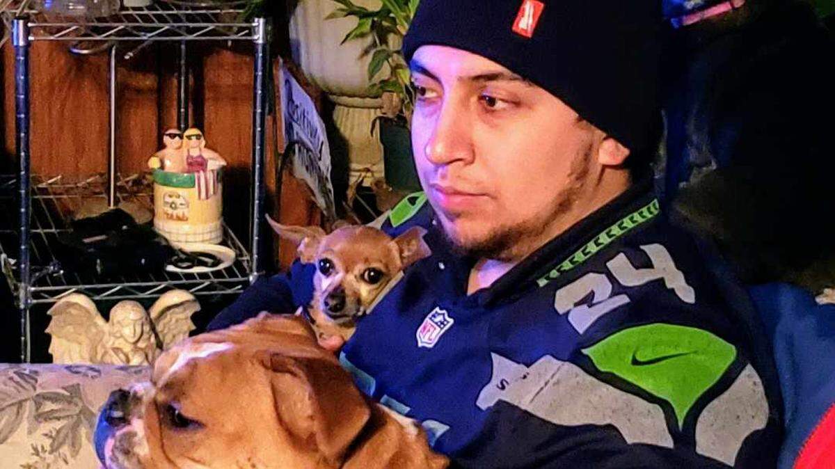 Daniel Zarate sits here with his bulldog Chula. He died in a crash on Highway 12 last week, just eight days after the funeral for his great-grandmother.