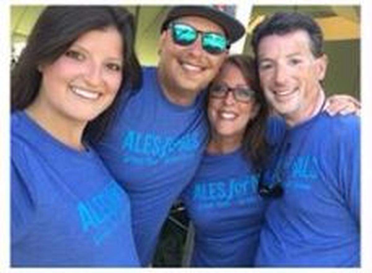 John Michaud, right, with his family.