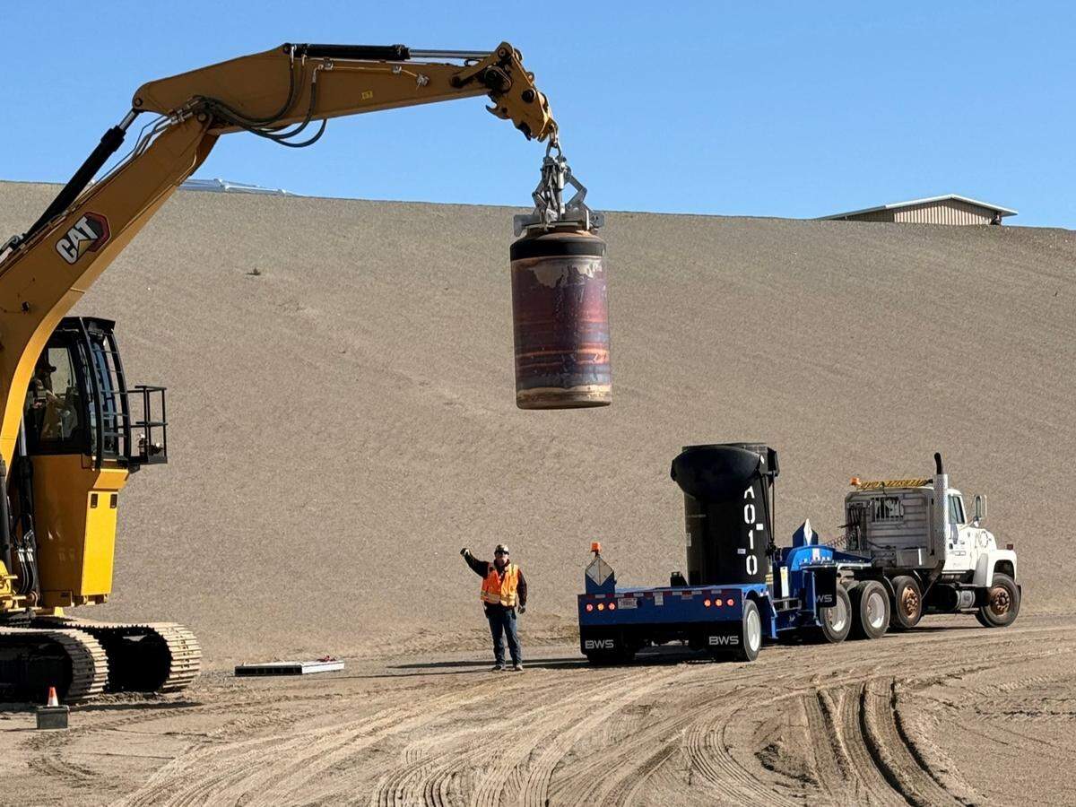 The first container of radioactive waste glassified at the Hanford nuclear site vitrification plant was disposed of in a lined landfill Wednesday.