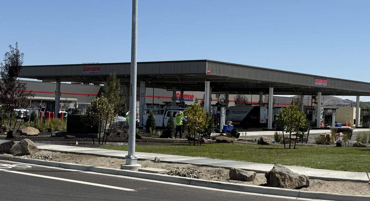 Landscapers prep the fueling station area of the Richland Costco Wholesale store for its Aug. 8, 2025 grand opening.