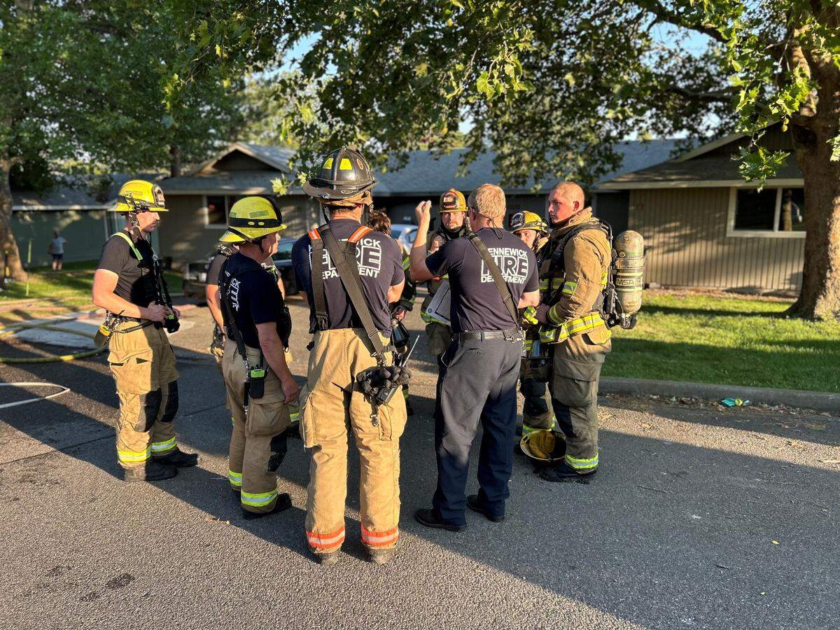 Kennewick firefighters responded to a fire in a duplex on Sixth Avenue on Friday