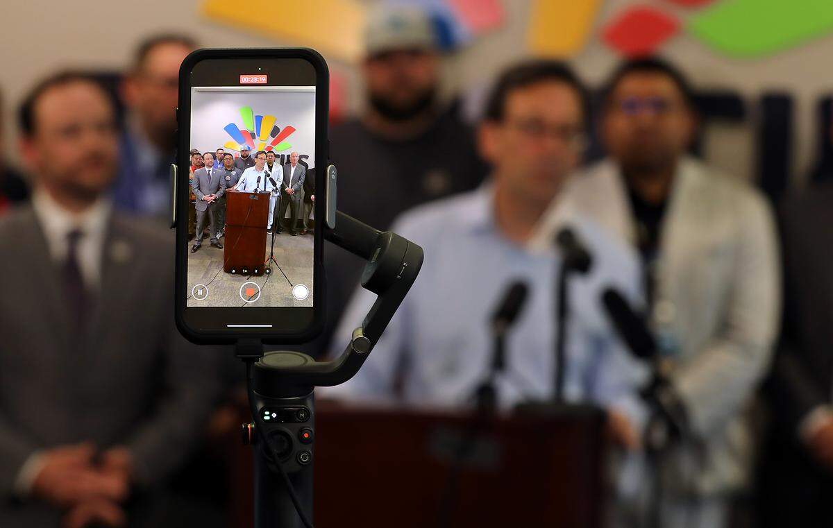 Wash. Gov. Bob Ferguson speaks at a news conference Friday about the Department of Energy’s possible plan to delay or cancel startup of the Hanford Waste Treatment Plant next month. State, tribal and community leaders stand behind him at the TRIDEC office in Kennewick.
