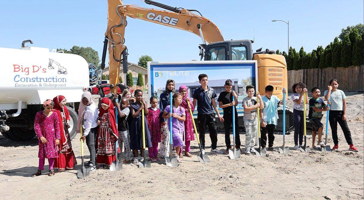 Children from B5 Community Learning Center participate in the ceremonial groundbreaking of a new building for the program.
