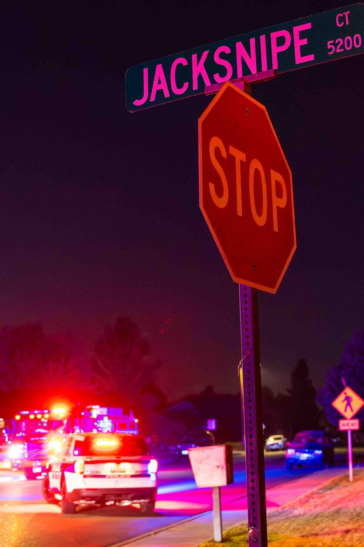 The Jacksnipe Court street sign marks the location of an early morning residential fire in the 5200 block of Jacksnipe Court on Sunday in West Richland.