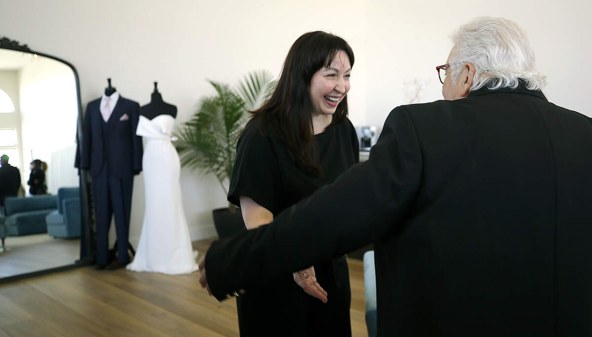 Owner Amber Keller is congratulated by Skip Novakovich, Port of Kennewick commissioner, following the ribbon cutting ceremony.