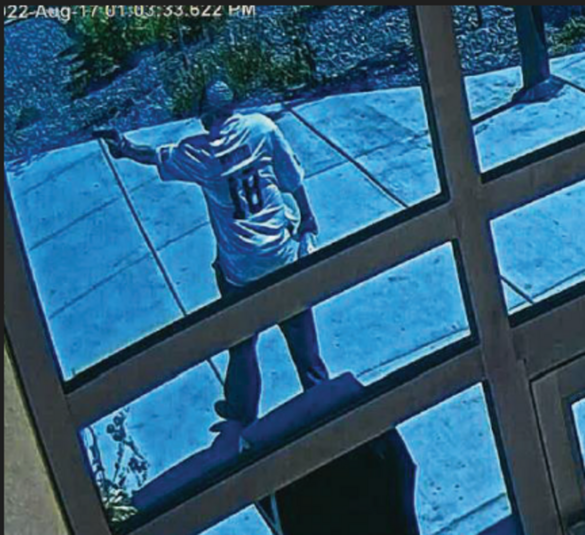 This image taken from security footage shows Wildhorse Casino robbery suspect Javier Francisco Vigil pointing a gun outside the casino.