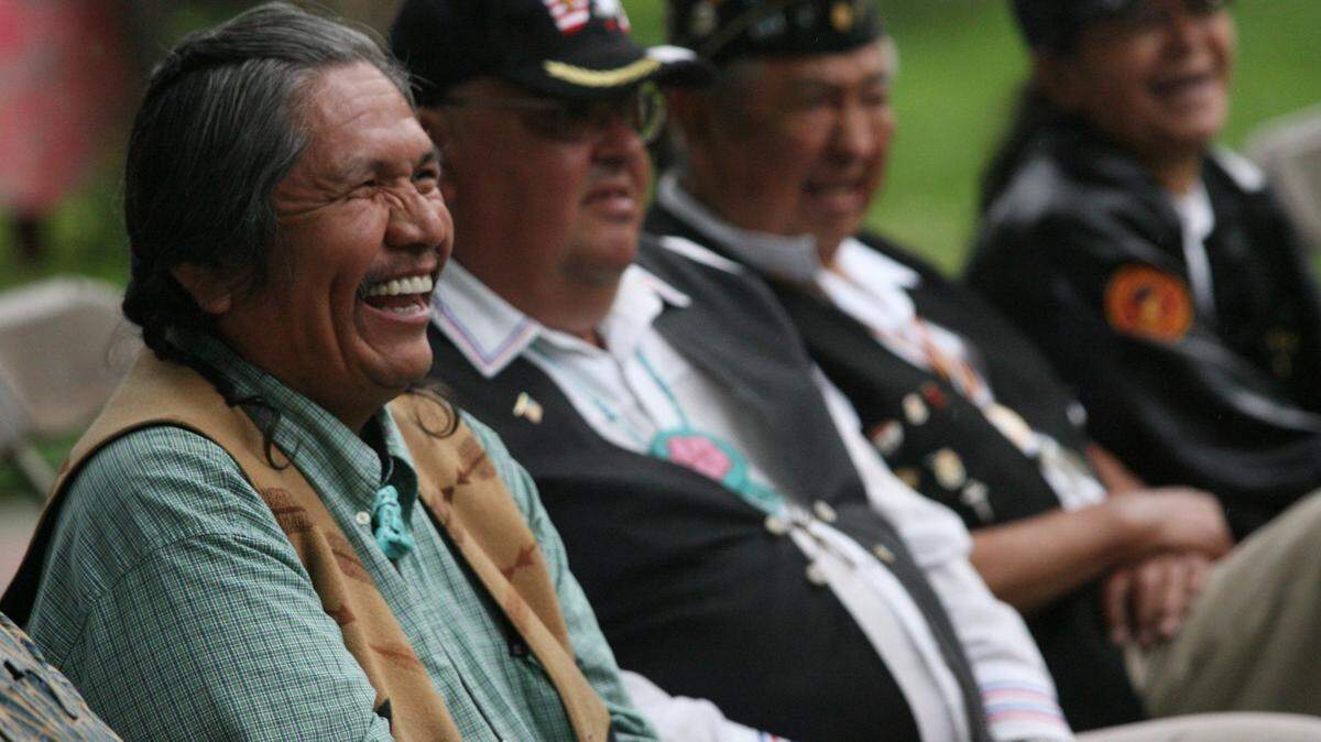 Rex Buck laughs at a joke during the dedication ceremony for the Sacajawea State Park Interpretive Center in Pasco in 2007. Buck, the leader of the Wanapum Band, died Feb. 11, 2022.