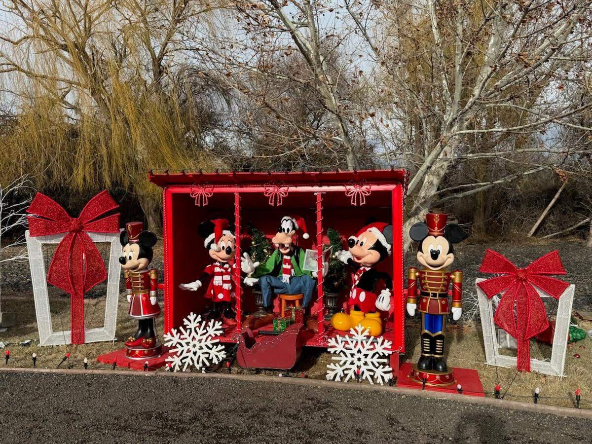 Disney characters Minnie, Goofy and Mickey are part of the Christmas decorations at a Richland home on Columbia Park Trail.
