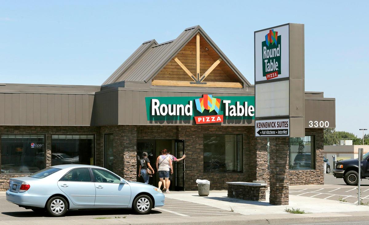 Kennewick-based Columbia Industries said it will close a deal this month to purchase four local Round Table Pizza restaurants, including this location at 3300 West Clearwater Avenue, from Chuck Stack, a 30-year franchisee.