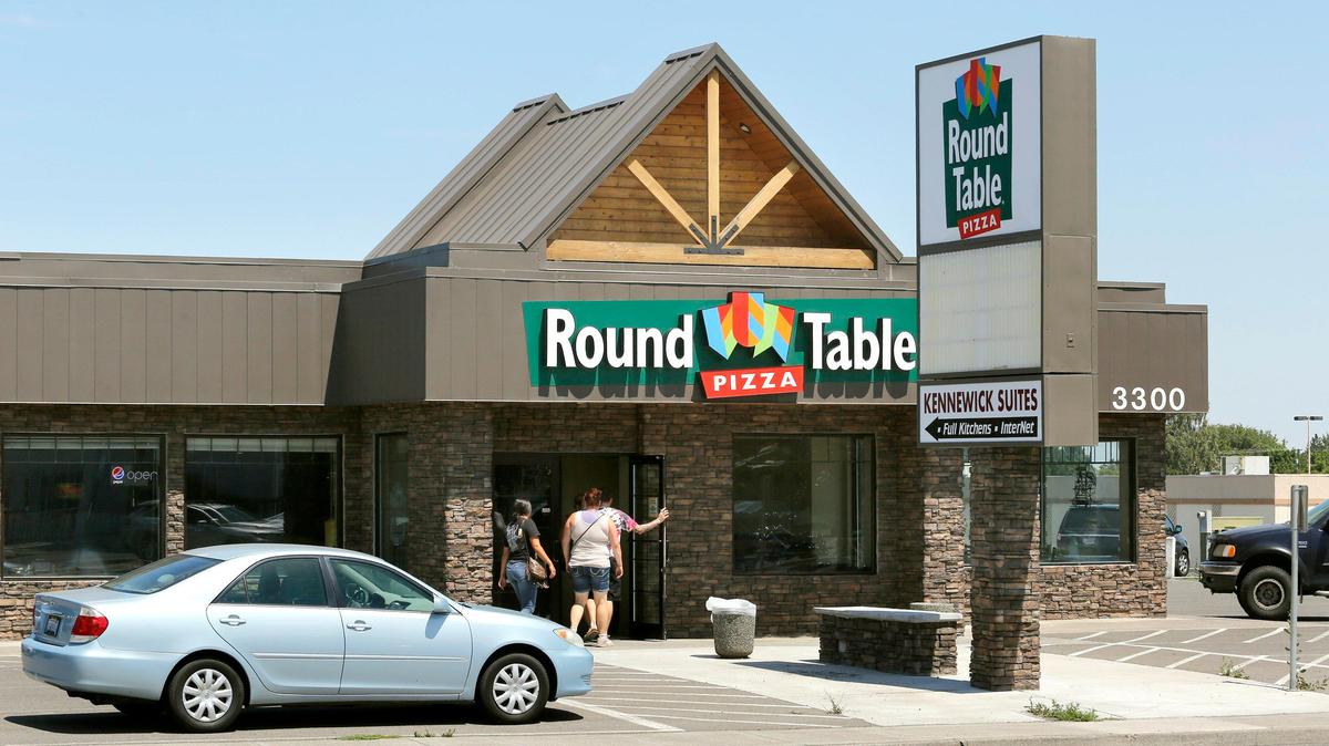 Kennewick-based Columbia Industries said it will close a deal this month to buy four local Round Table Pizza restaurants, including this location at 3300 West Clearwater Ave.