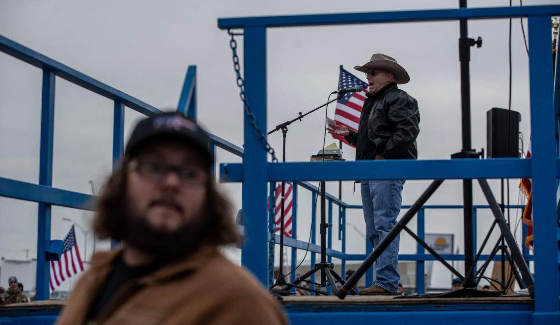 State Rep. Brad Klippert speaks to hundreds of people who gathered in a north Richland parking lot in 2021 to rally against the federal vaccine mandate on behalf of Hanford and PNNL workers.