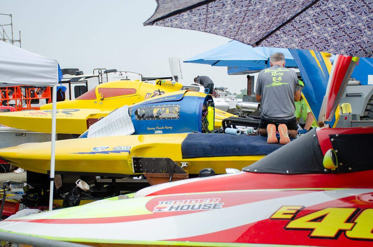 Crew members work on hydroplanes Saturday, July 27, 2024 in the Lampson Pits in Columbia Park during the 2024 Water Follies Apollo Columbia Cup and STCU Over-the-River Air Show.