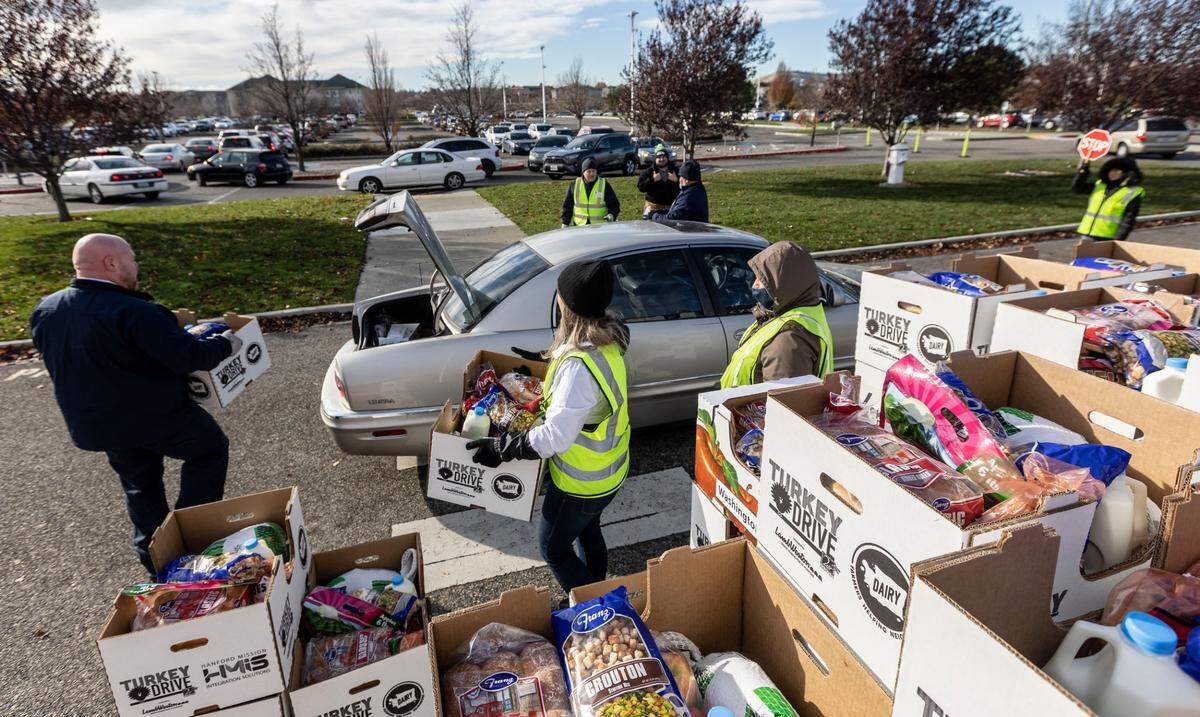 Second Harvest staff and volunteers to hand out Thanksgiving meal boxes during the 2021 Turkey Drive at the Toyota Center in Kennewick.