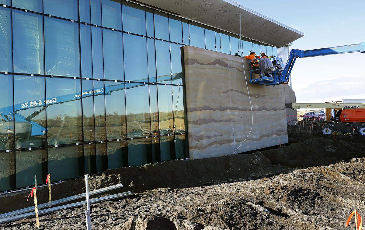 Construction crews work on exterior of the Pasco Aquatic Center in west Pasco. 