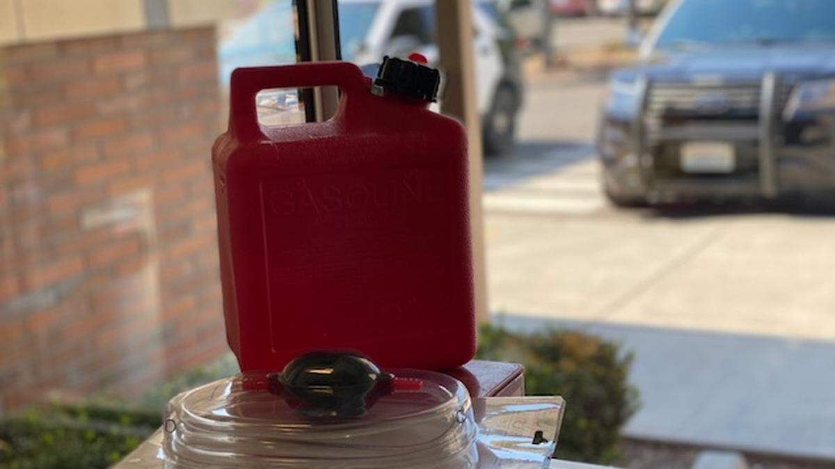 A 31-year-old Kennewick man allegedly had a gasoline can and siphoning hose on him when arrested for scaling a fence to the Kennewick Police Department's secured parking lot, intending to steal gas from patrol cars.