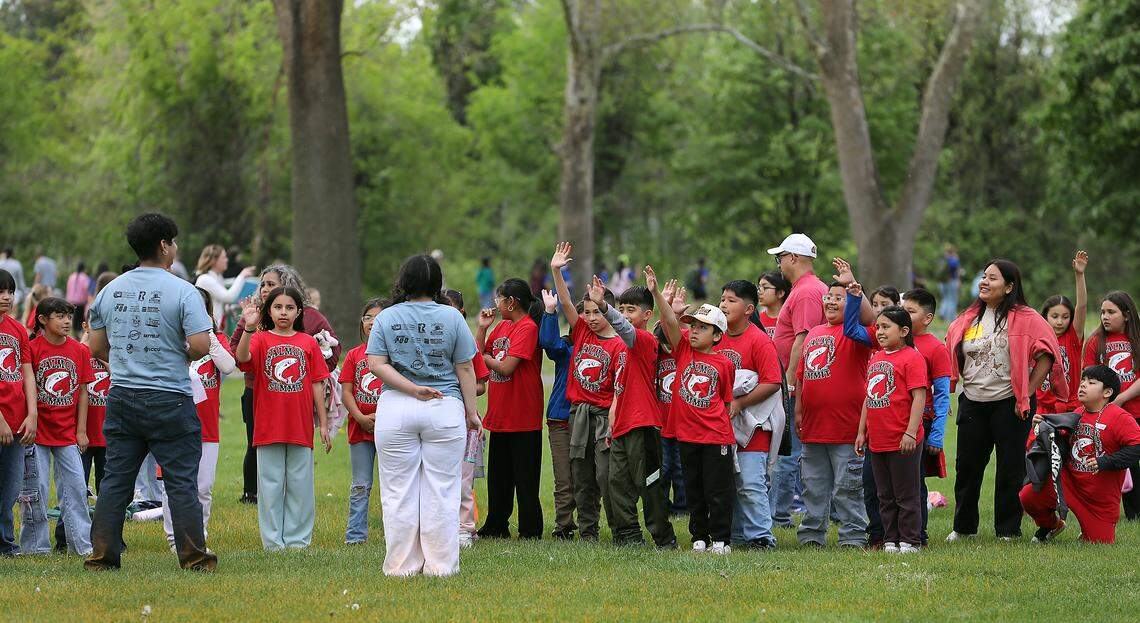 Elementary students take part in one of 60 activities in Columbia Park after releasing the salmon fry they raised in their classroom.