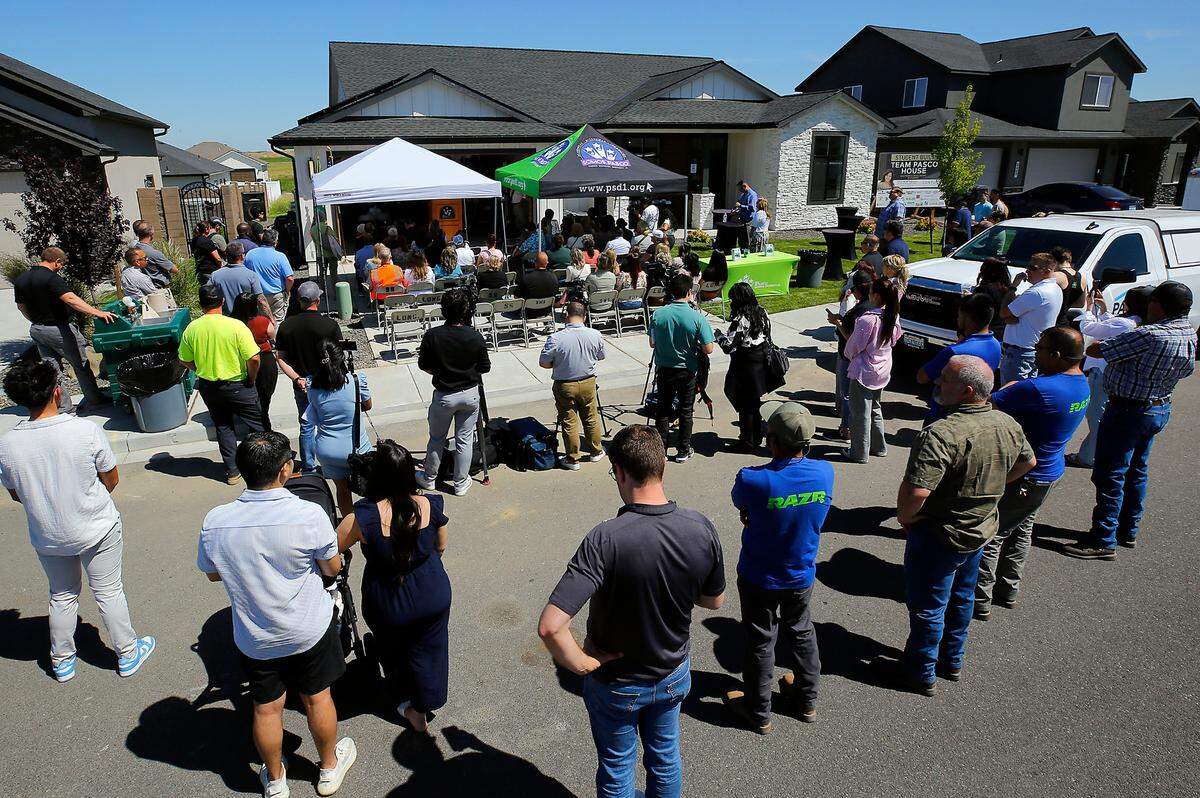 A crowd gathers for the dedication of the 25th Team Pasco House, built by Pasco School District students. The custom-built home was listed on the market for $524,900.