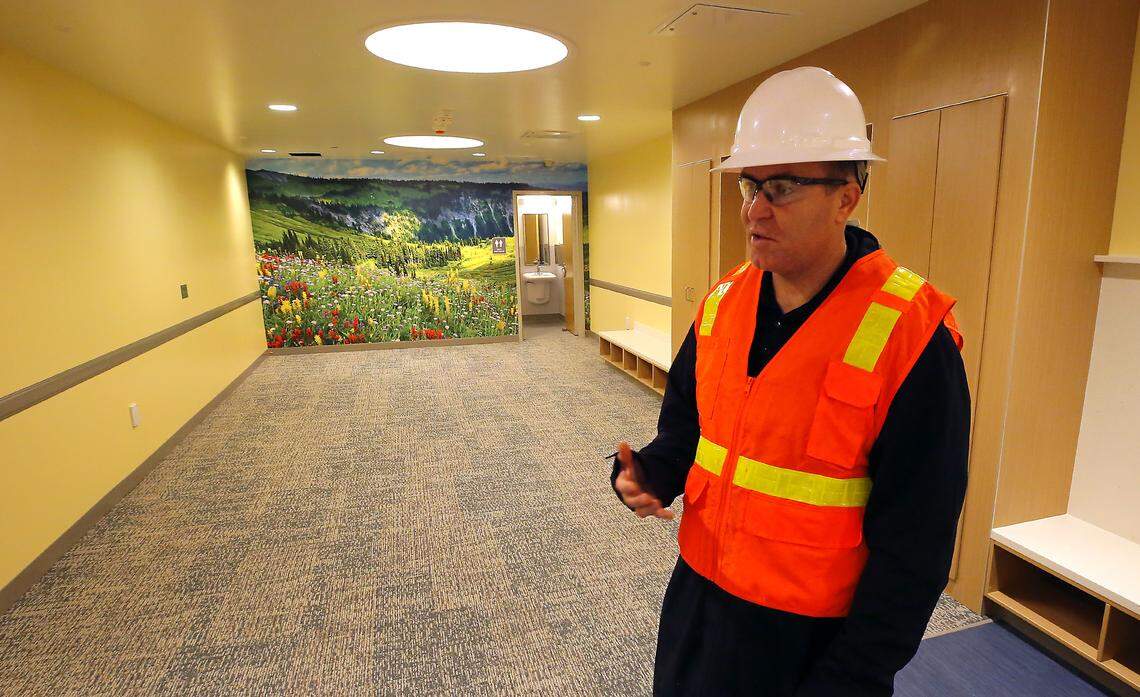 Matt Rasmussen, Benton County deputy administrator, stands in a family room of the Columbia Valley Recovery Center in downtown Kennewick discussing the construction progress of the facility.