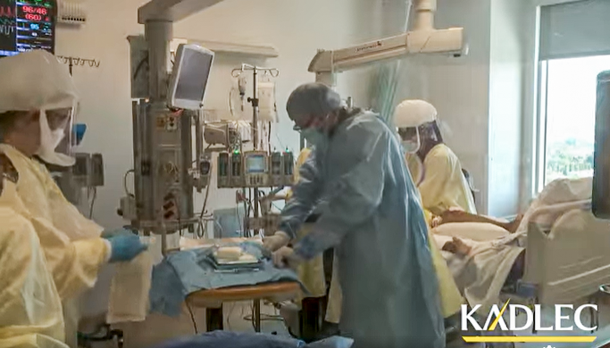 Staff at Kadlec Regional Medical Center in Richland care for a patient in the intensive care unit, in this screenshot from a video.