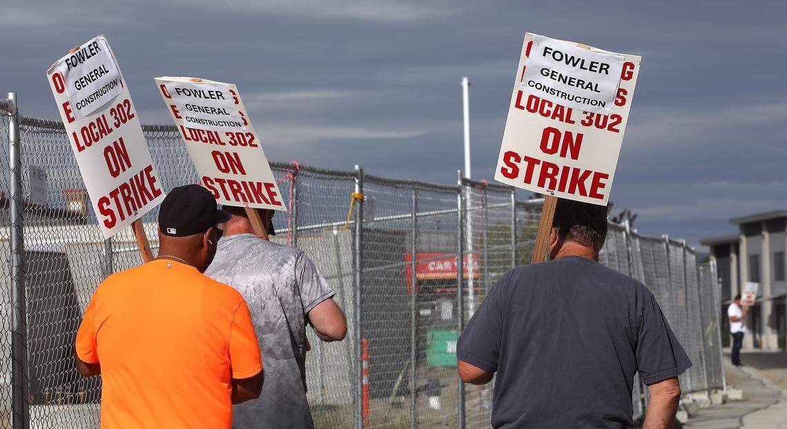Picketers were outside the motel construction project Friday morning off Earhart Drive near the Tri-Cities Airport in Pasco. IUOE Local 302 represents heavy equipment operators who run excavators, cranes, bulldozers and other construction equipment.