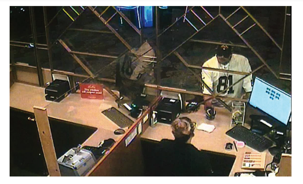 This image from security footage shows Wildhorse Casino robbery suspect Javier Francisco Vigil pointing a gun at a cashier.