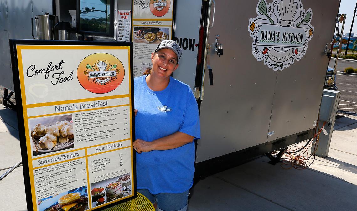 Chris Schwartz, owner and chef of Nana’s Kitchen, holds a menu for her new mobile eatery at the Food Truck Plaza at Columbia Gardens in Kennewick.