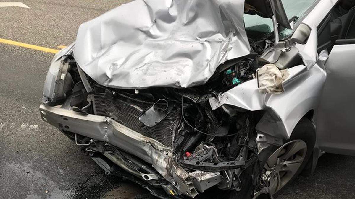The front end of a Honda was crushed in a head-on crash that sent two men to the hospital with injuries.