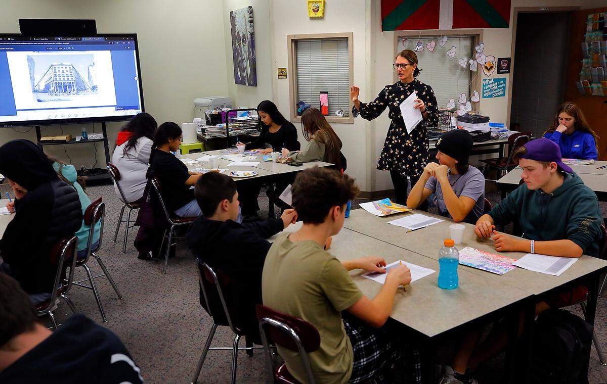 Tina Larios talks with students about an assignment for her art class at Columbia High School in Burbank. The rural school district is bracing for possible growth from a boom in new industries targeting the area.
