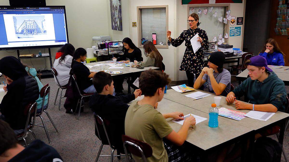 Tina Larios talks with students about an assignment for her art class last winter at Columbia High School in Burbank.
