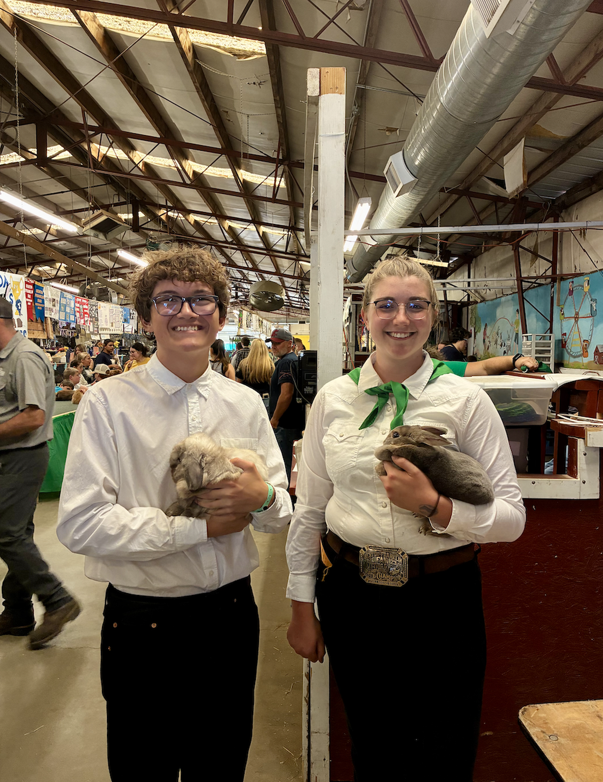 Adalise Ahl and Xavier Torrescano show their rabbits, Silvie and Potato, at the Benton Franklin Fair. Both longtime 4-H members, they say caring for rabbits teaches responsibility while giving them a chance to share their animals with the community.