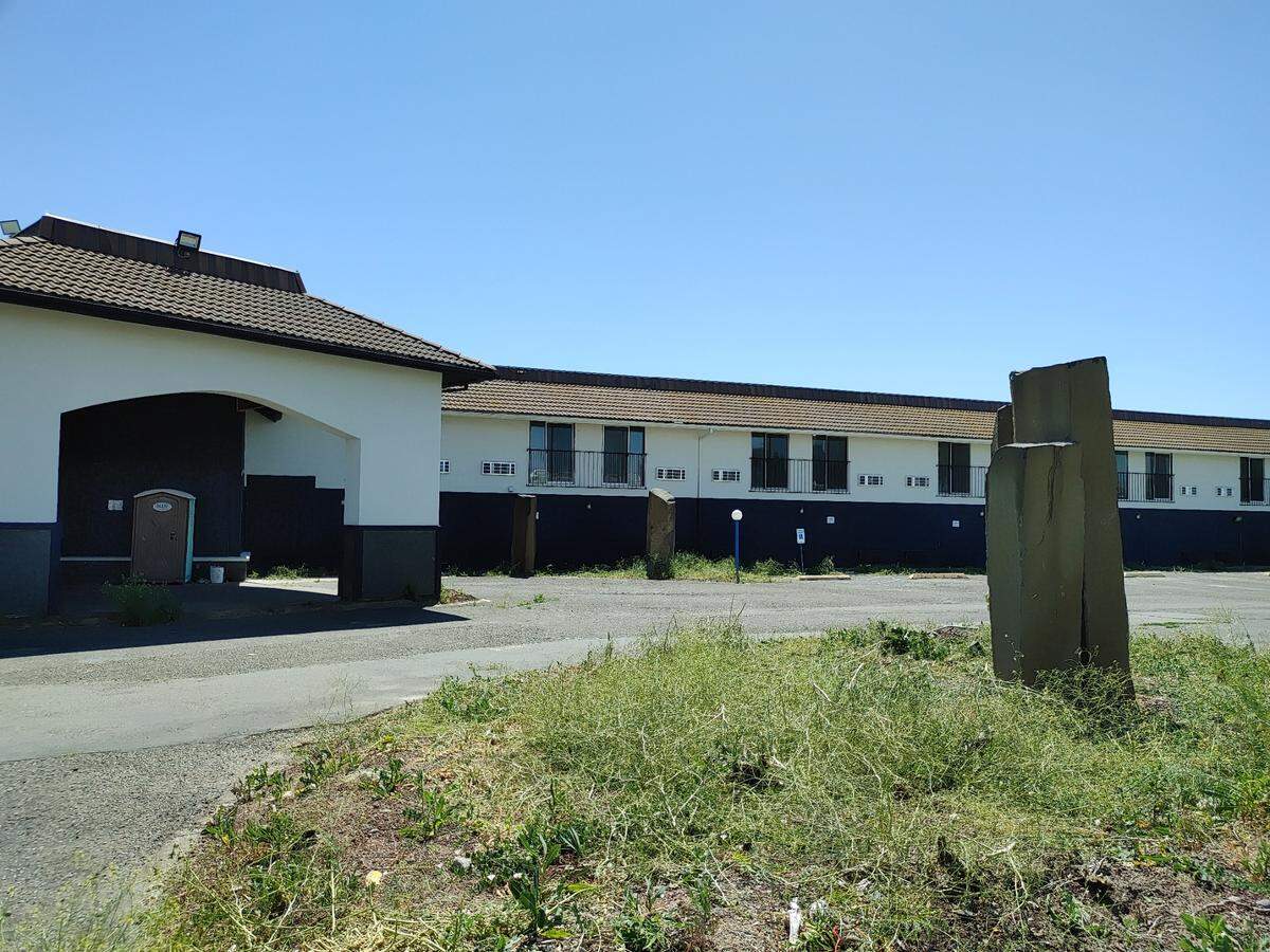 The Kenn, formerly the Kennewick Motel 6, sites vacant and boarded up yeas after Fortify Holdings of Portland bought it as part of a buying spree that netted six local properties. Five were converted to micro-apartments but The Kenn was supposed to provide seasonal housing for agricultural workers.