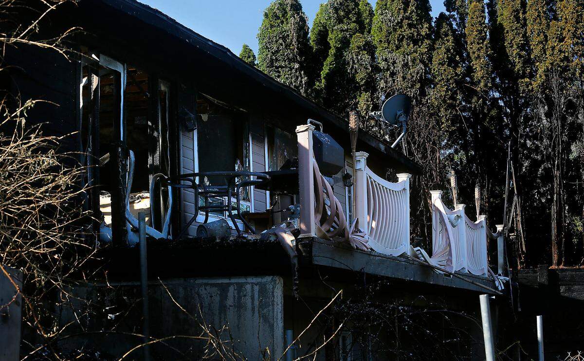 The 2,400 square-foot rambler owned by Glen Clark as a rental property at 2212 South 8th Pl. in Kennewick has a partially collapsed roof and sustained heavy interior and exterior damage after catching fire during Sunday’s brushfire in Zintel Canyon. No injuries were reported in the fire.