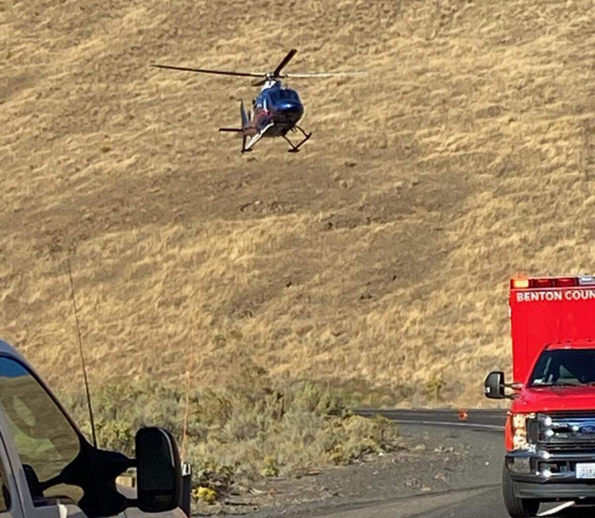 A medical helipcopter prepares to land at the scene of a injury semi-truck rollover crash Thursday morning on Webber Canyon Road in rural Benton County to fly the seriously injured male driver to a local hospital for medical treatment.