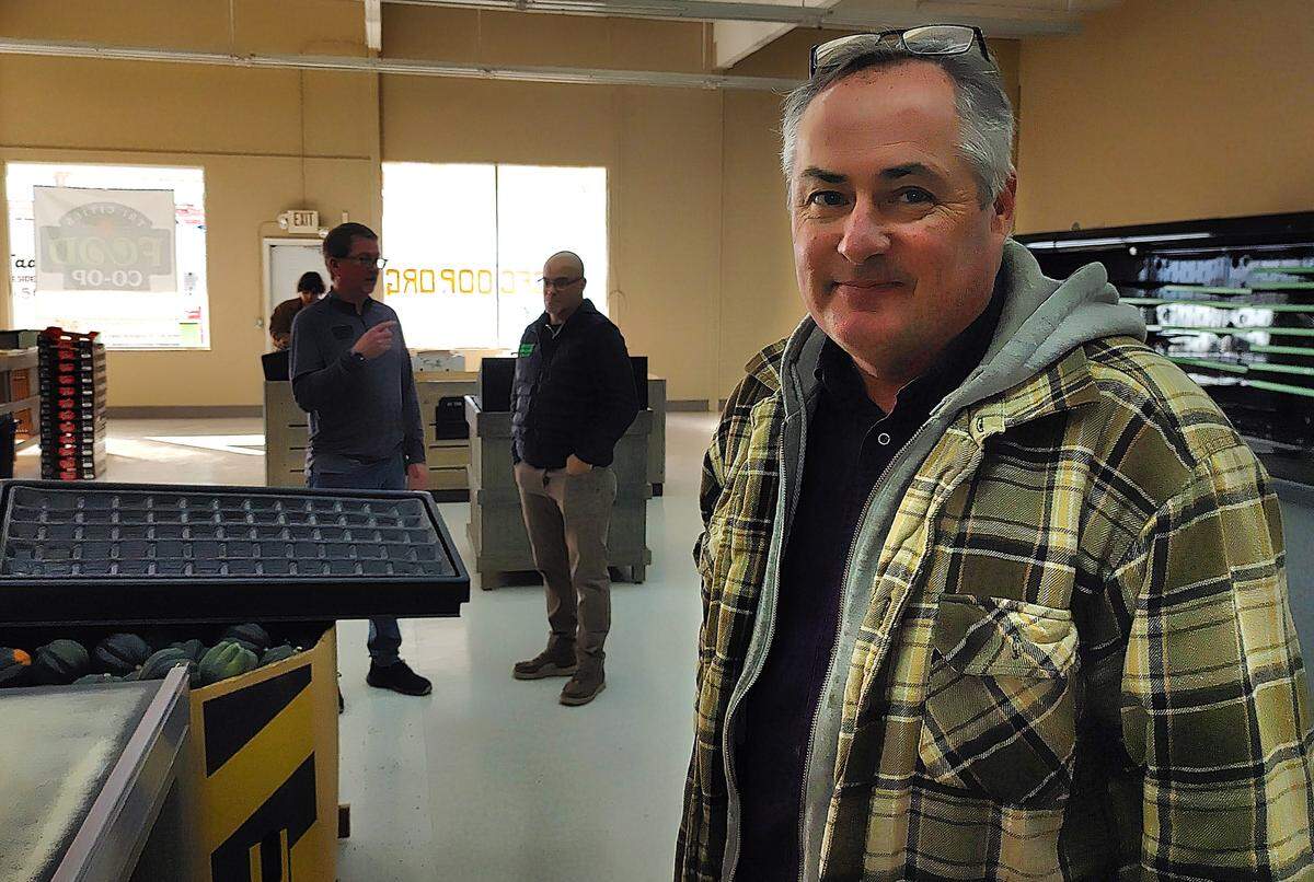 Alan Schreiber pauses during preparations to open the Tri-Cities Food Co-Op Oct. 30 at 1420 Jadwin Ave., Richland.