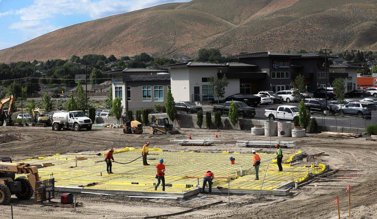 Construction crews work on pouring the concrete slab for the new Idaho Central Credit Union at 3180 Duportail St. in Richland. It’s one of three ICCU is constructing as it prepares to enter the Tri-Cities market in late 2025. The 5,000-square-foot building will cost about $5.2 million.