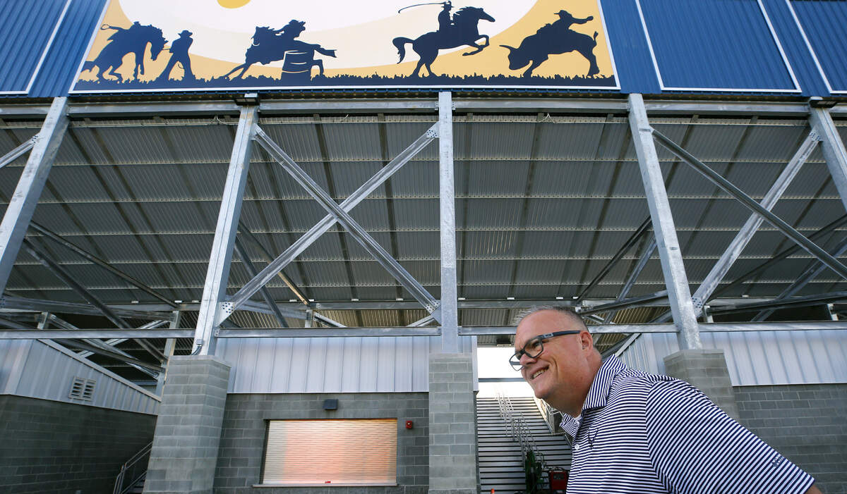 Tom French, director of the Benton County Fairgrounds, stands outside the new $12 million grandstands structure built at the McDaniel rodeo arena at the facility in Kennewick. The iconic rodeo mural, prominently displayed on the previous grandstands, was digitally reproduced to remain featured above the main entrance.