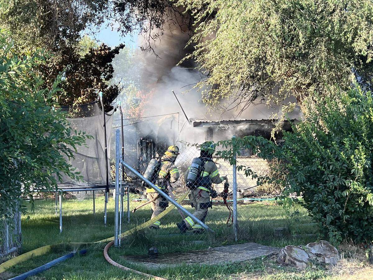 Benton Fire District 1 were called to a house fire in East Kennewick shortly before 7 a.m. Sunday. Two firefighters and the homeowner needed medical attention.