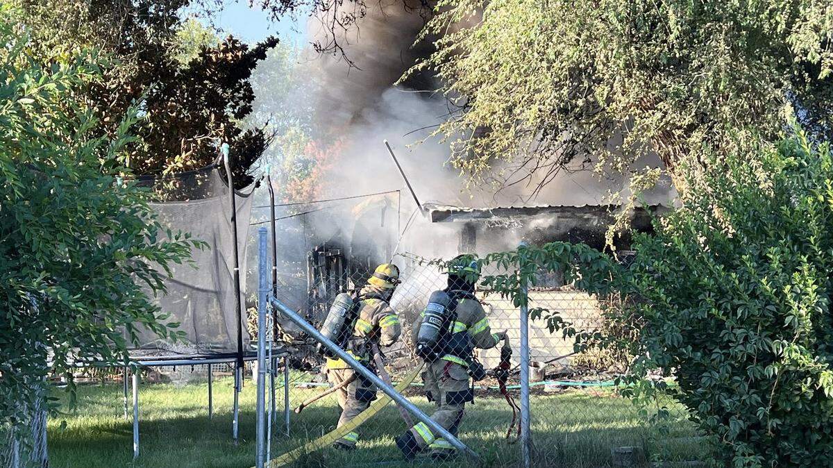 Benton Fire District 1 were called to a house fire in East Kennewick shortly before 7 a.m. Sunday. Two firefighters and the homeowner needed medical attention.
